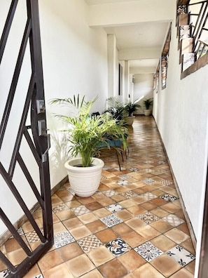 Hallway leads to main house kitchen door and entrance to casita. 