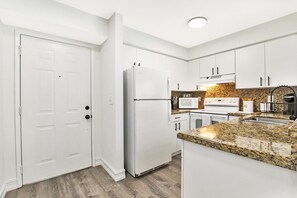 Fully equipped kitchen with granite countertops