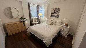 Large bedroom with built in wardrobes