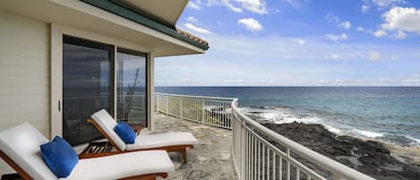 Indulge in oceanfront luxury at Ali'i Point #12, your perfect Hawaiian retreat, featuring a private lanai with unparalleled sea views, perfect for high-end relaxation and sunbathing.