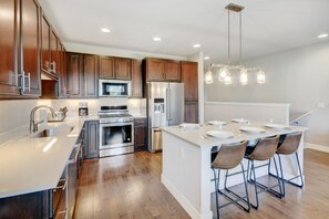 Large kitchen with island dining for 6