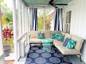 Enjoy a morning coffee or an afternoon cocktail on the comfortable front porch