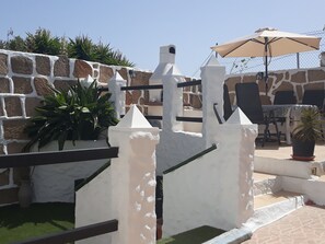 View up to the top terrace with BBQ & dining area