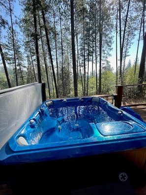 A multi person jacuzzi with a beautiful view for your enjoyment
