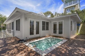 REAR EXTERIOR VIEW OF POOL AND DECK