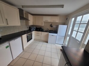 Kitchen- equipped with 2 fridges, 2 freezers, washing machine and dishwasher.