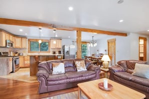 Family room with comfortable sofa seating and fully-equipped kitchen