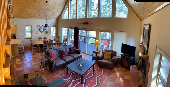 Living area on main floor with dining room in the background.