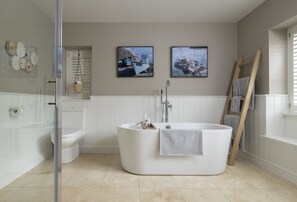 Ground floor: Beautiful en-suite bathroom with a free-standing bath and separate walk-in shower