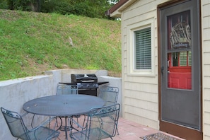 Back patio and gas grill 
Main entrance to the house with smart lock