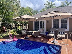 Large tiled and heated pool with lounges