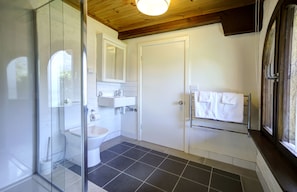 Newly renovated ensuite with heated towel-rack, shower, toilet.