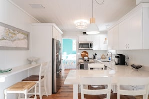 Newly remodeled kitchen with quartz counters and stainless appliances