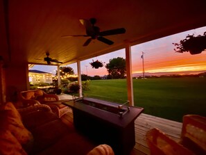 Porch Deck with gas fire table under the evening glow.

