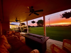 Porch Deck with gas fire table under the evening glow.