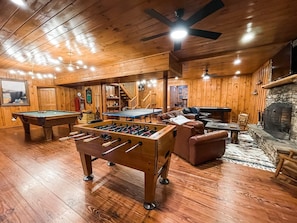 Downstairs game room with 55" TV, DISH, gas fireplace, air hockey, ping pong....