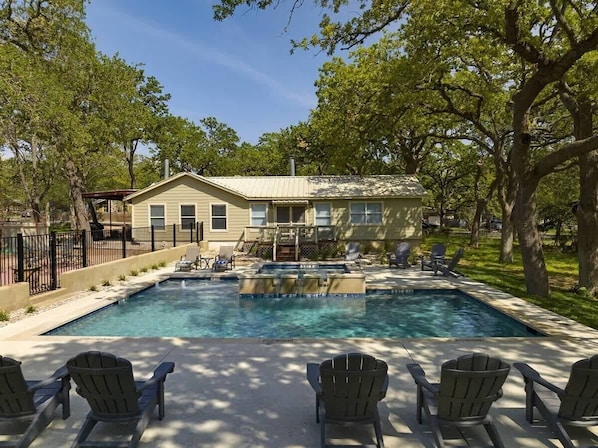The pool backs right up to the house