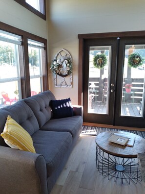 Living room with French doors leading to the front porch