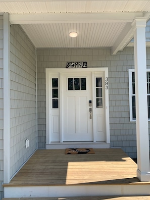 Front door with easy to identify house name and address numbers.