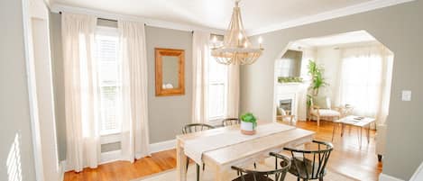 Formal dining room with plenty of seating to enjoy games or family meals.