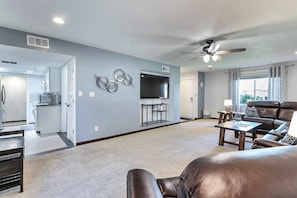 View of kitchen from the living area and front entrance