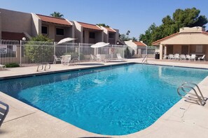 Side view of the pool with plenty of places to sit.