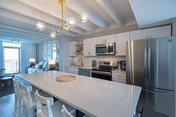 Luxury fully equipped open kitchen, living and dining area with 8-foot island