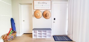 Entryway with plenty of space to store your shoes, hats, towels & beach gear.