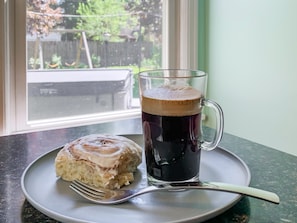 Can't you see yourself enjoying this nice cup of espresso?! Coffee bar; espresso maker; traditional coffee maker (coffee/espresso provided, cinnamon rolls are not)