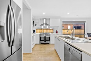 Fully equipped kitchen with cooking appliances and plenty of cooking utensils for the times you just want to stay in.