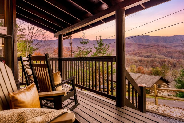 Sink into relaxation on 'Bear Bottom' cabin's front porch.                      