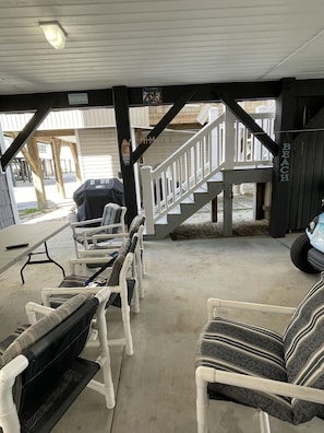 Stairs, seating area, and Weber propane BBQ grill