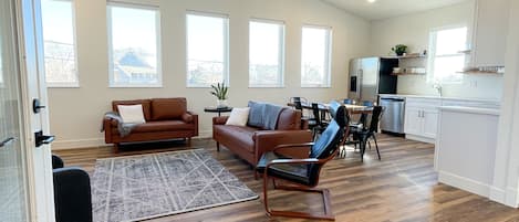 Windows line the open floor plan giving a bright, light filled living space.