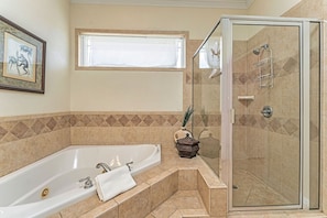 Jacuzzi tub in master bedroom bath with standup shower