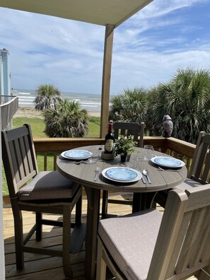 Shaded deck on 1st floor. Beach views, palm tree privacy. Breakfast in your pjs!