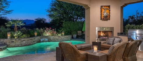 Outdoor fireplace with seating area