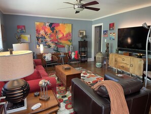 Colorful and comfortable living room with lots of original art!
