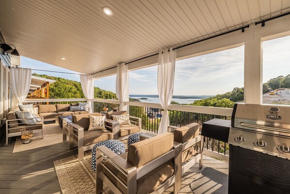 Relax on the covered main-level deck, offering stunning views of Table Rock Lake.