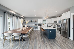 Prep and cook in the main-level kitchen, one of 2 fully equipped kitchens at Driftwood Lodge