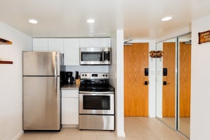 Fully stocked kitchen to reheat take-outs and cook simple meals.