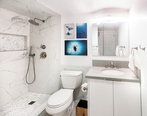 Sleek, clean, and modern bathroom. Bath and beach towels are provided!