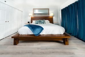 Comfortable king size bed on a luxury platform bed frame.