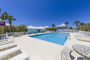 Need a break from the beach? Dive into fun at the community pool, just minutes from the property—your perfect oasis for relaxation and splashes!