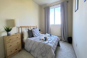 Comfortable double bed w/blackout curtains to help keep you in the perfect dream