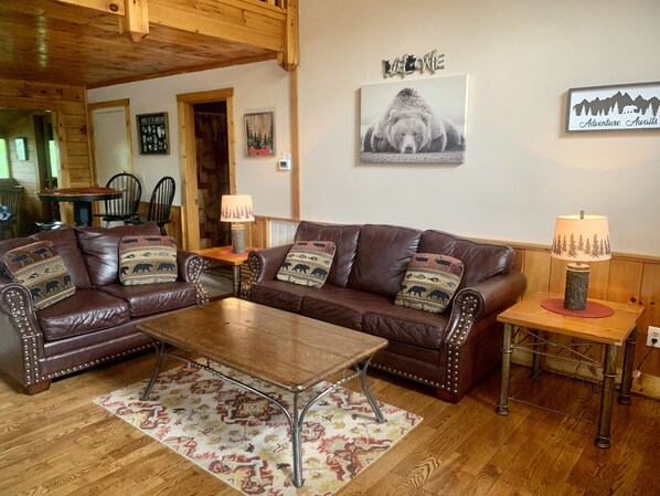 Main level living room with queen sleeper sofa