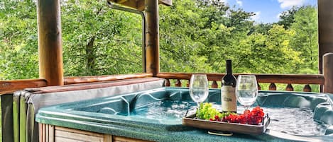 Hot tub in private back porch for your relaxation.