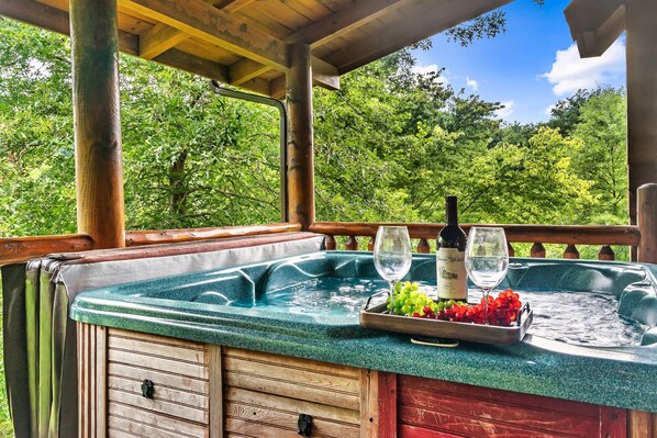 Hot tub in private back porch for your relaxation.