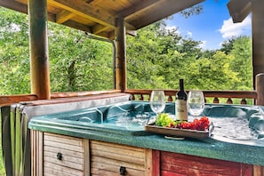Hot tub in private back porch for your relaxation.