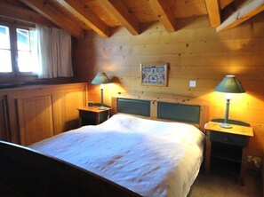bedroom one with a double sized bed 