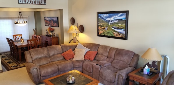 Comfy reclining sectional with matching recliner. seats 8 all together 